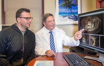 Doctor showing patient 3D images