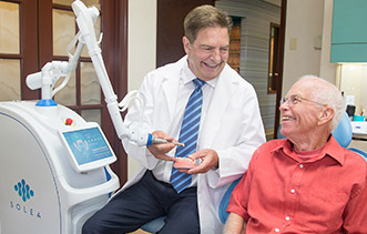 Dr. Davidson uses a dental laser to provide minimally invasive treatment whenever possible.